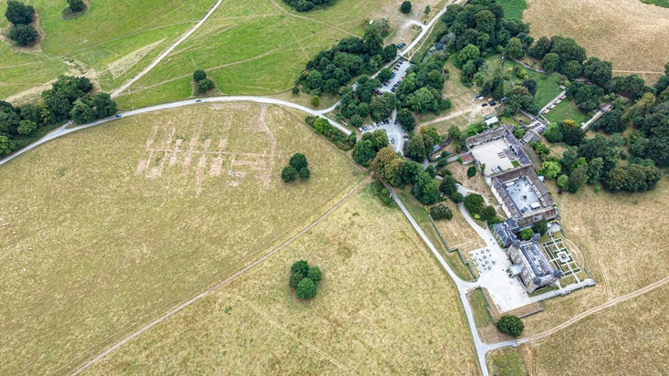 Aerial image show parch marks at Dinefwr revealing the remains of former Nissen huts